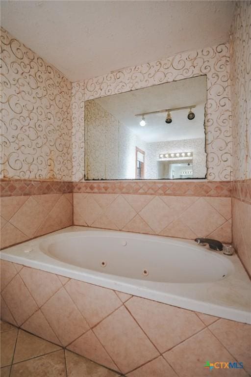 bathroom with a relaxing tiled tub and tile patterned flooring