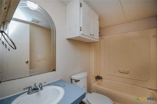 full bathroom with tub / shower combination, sink, and toilet