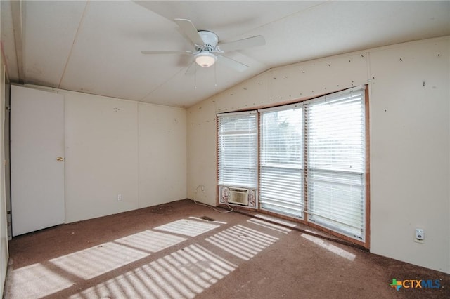 spare room featuring lofted ceiling, cooling unit, and ceiling fan