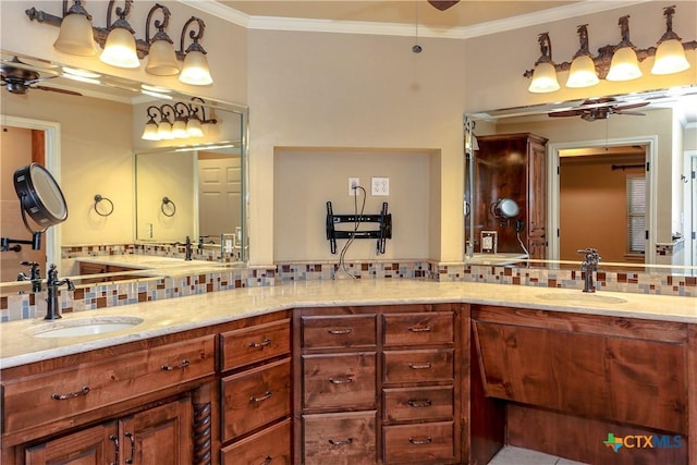 bathroom with vanity, crown molding, and ceiling fan