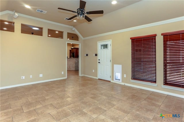 unfurnished room featuring crown molding, vaulted ceiling, and ceiling fan