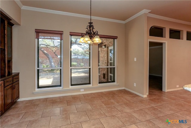 unfurnished dining area featuring crown molding, light tile patterned floors, and an inviting chandelier