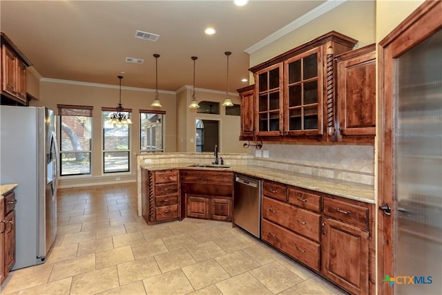 kitchen with sink, tasteful backsplash, hanging light fixtures, appliances with stainless steel finishes, and kitchen peninsula