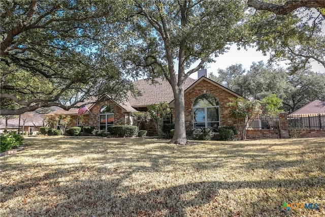 view of front property with a front lawn