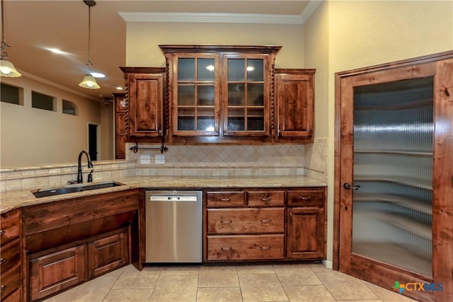 kitchen with hanging light fixtures, ornamental molding, sink, and stainless steel dishwasher