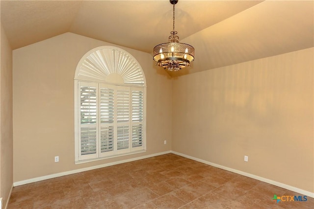 empty room with an inviting chandelier and lofted ceiling