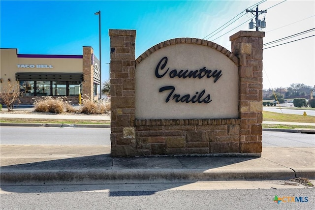 view of community sign