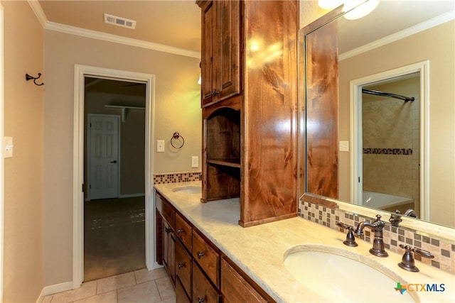 bathroom with ornamental molding, vanity, tile patterned flooring, and backsplash