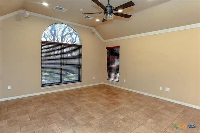 empty room featuring vaulted ceiling, ornamental molding, and ceiling fan