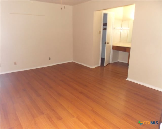 empty room featuring hardwood / wood-style floors