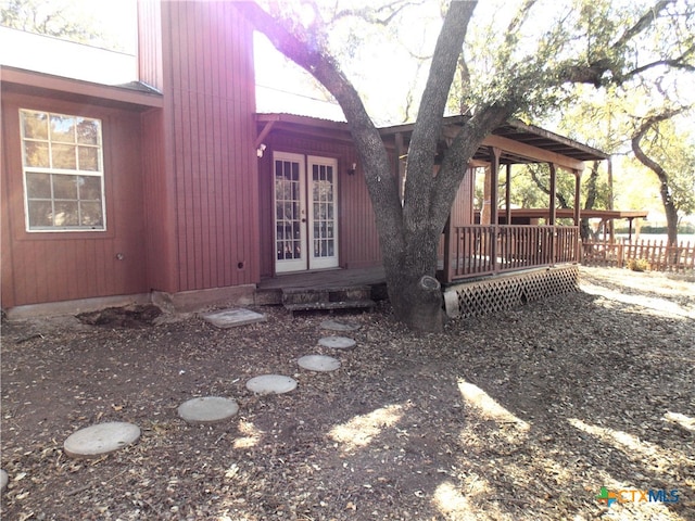 view of side of property with a deck