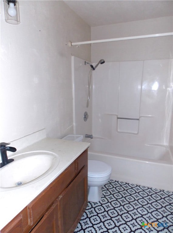 full bathroom with vanity, toilet, and  shower combination