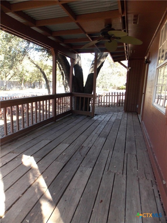 wooden deck featuring ceiling fan