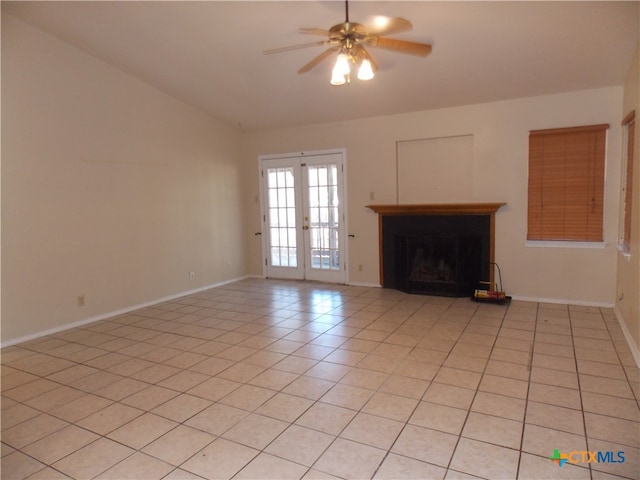 unfurnished living room featuring light tile patterned flooring, french doors, vaulted ceiling, and ceiling fan