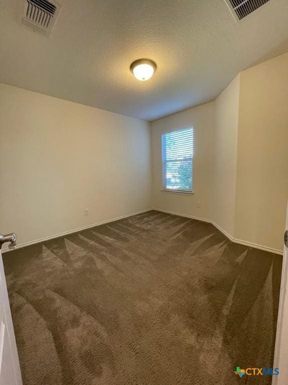 2092 Brandywine Dr, New Braunfels, TX 78130 - spare room with dark colored carpet, baseboards, and a textured ceiling