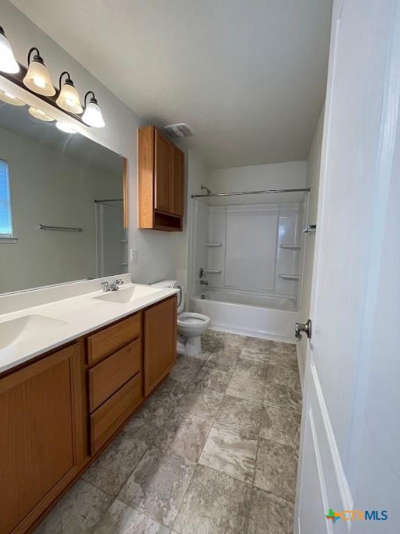2092 Brandywine Dr, New Braunfels, TX 78130 - bathroom featuring toilet, double vanity, and washtub / shower combination