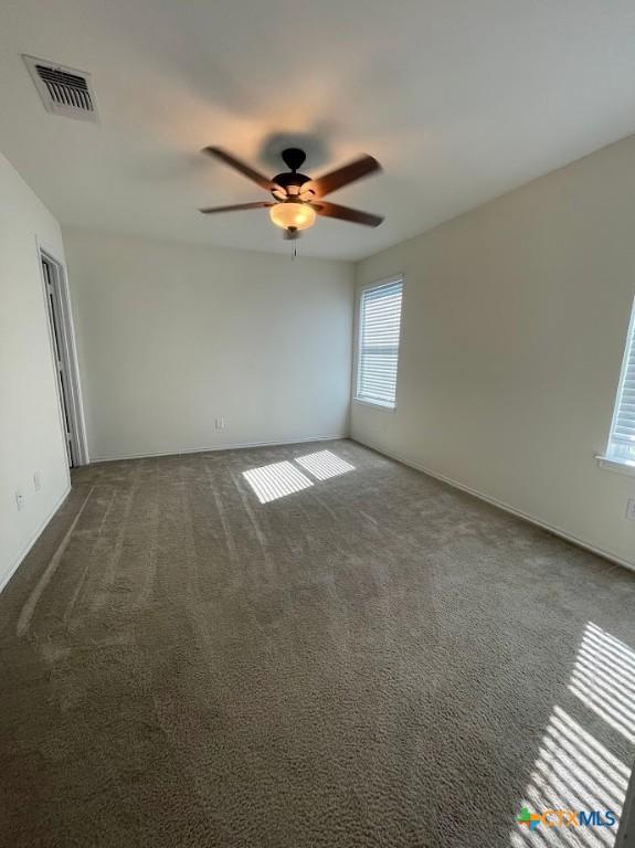 2092 Brandywine Dr, New Braunfels, TX 78130 - spare room with a ceiling fan and dark carpet