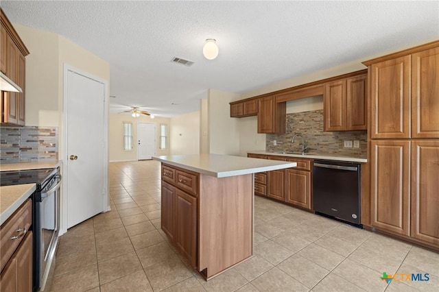 4205 Beach Ball Dr, Killeen, TX 76549 - kitchen with dishwashing machine, stainless steel electric stove, light tile patterned floors, tasteful backsplash, and a textured ceiling