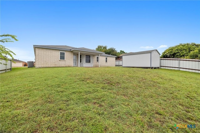 4205 Beach Ball Dr, Killeen, TX 76549 - back of house with a storage unit and brick siding