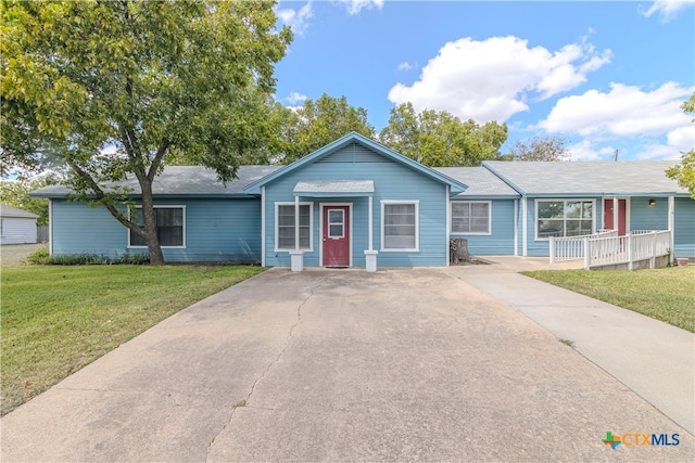 ranch-style house with a front lawn