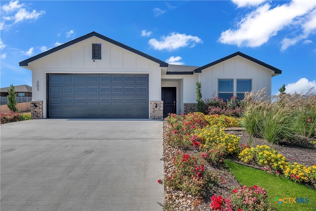 ranch-style home featuring a garage