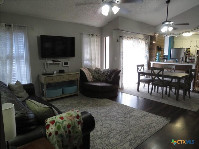 310 Rattan Dr, Victoria, TX 77901 - living room with ceiling fan, dark wood finished floors, and a textured ceiling