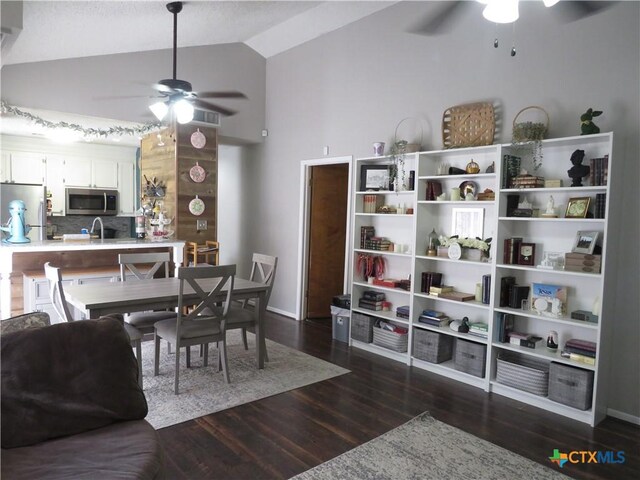 310 Rattan Dr, Victoria, TX 77901 - dining space with ceiling fan, lofted ceiling, and dark wood-style flooring