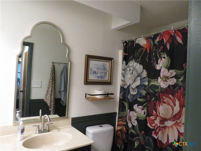 310 Rattan Dr, Victoria, TX 77901 - full bath with vanity, a textured ceiling, and curtained shower