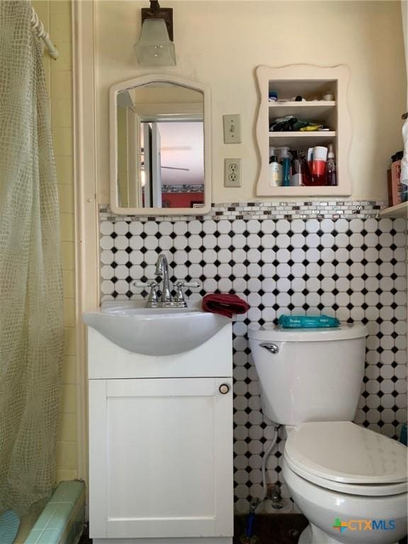 1101 S 17th St, Copperas Cove, TX 76522 - bathroom with a shower with shower curtain, toilet, and vanity