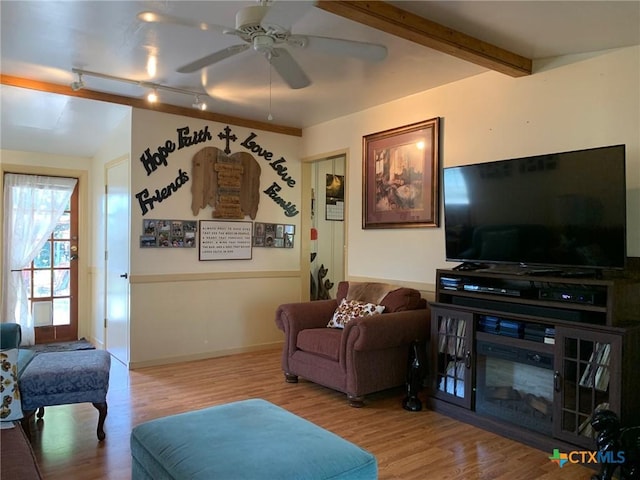 1101 S 17th St, Copperas Cove, TX 76522 - living area with wood finished floors, track lighting, a ceiling fan, and baseboards