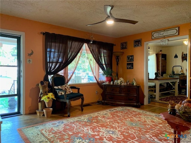 1101 S 17th St, Copperas Cove, TX 76522 - sitting room featuring a textured ceiling, wood finished floors, and ceiling fan