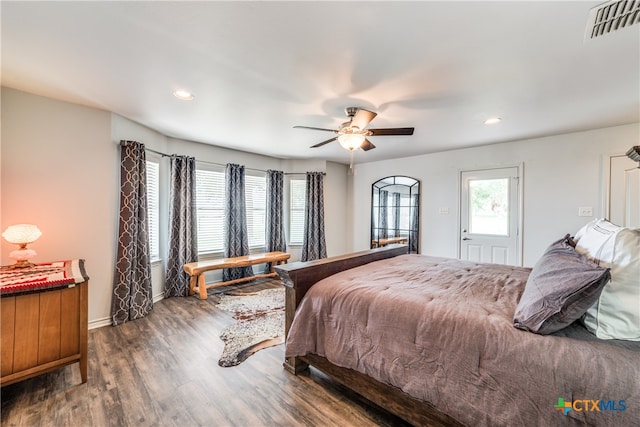 bedroom featuring dark hardwood / wood-style flooring and ceiling fan