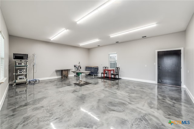 interior space featuring concrete flooring