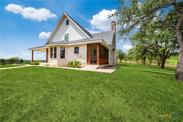 back of house featuring a yard