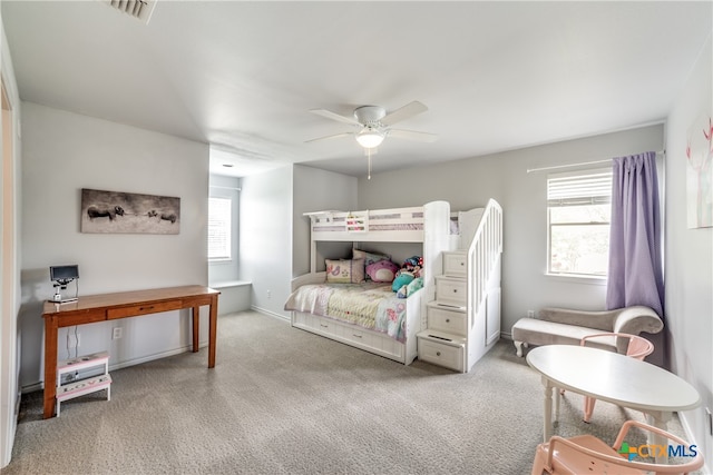 bedroom with light carpet and ceiling fan