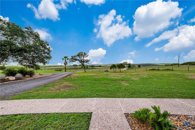 view of yard with a rural view