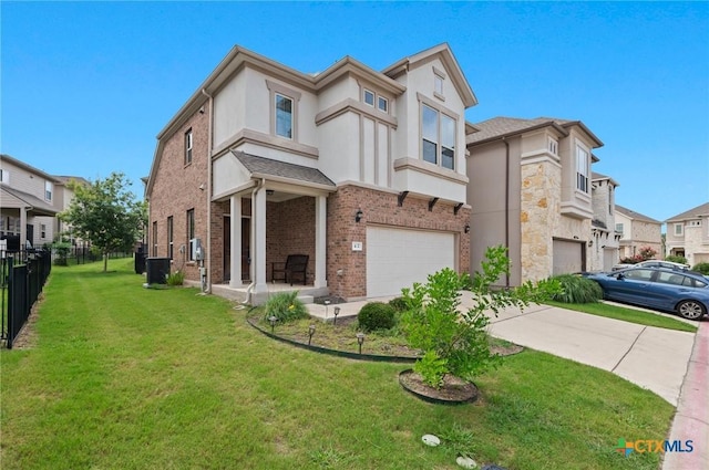 2105 Town Centre Dr Unit 42, Round Rock, TX 78664 - view of front of home featuring a garage, concrete driveway, stucco siding, brick siding, and a residential view