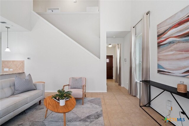 2105 Town Centre Dr Unit 42, Round Rock, TX 78664 - living area featuring a high ceiling and light tile patterned flooring