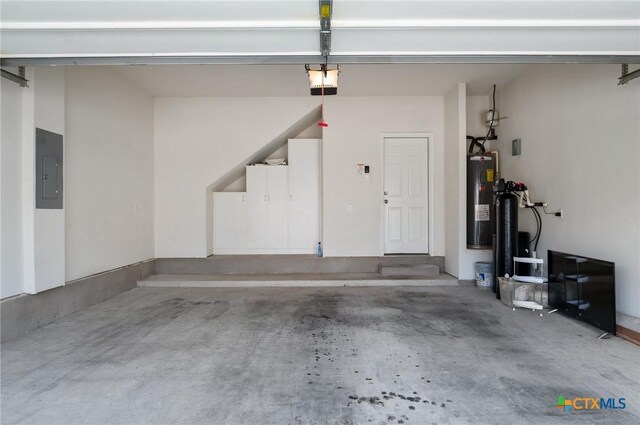 2105 Town Centre Dr Unit 42, Round Rock, TX 78664 - garage featuring electric water heater, electric panel, and a garage door opener