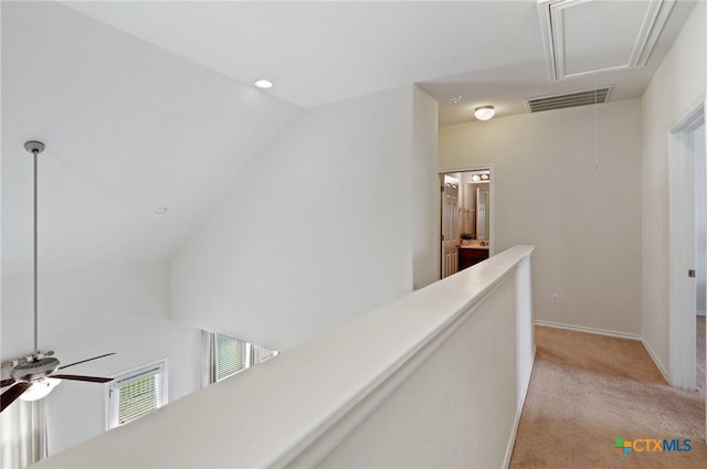 2105 Town Centre Dr Unit 42, Round Rock, TX 78664 - corridor featuring attic access, light carpet, lofted ceiling, an upstairs landing, and recessed lighting