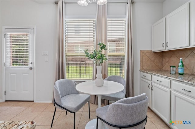 2105 Town Centre Dr Unit 42, Round Rock, TX 78664 - dining area featuring light tile patterned floors and baseboards
