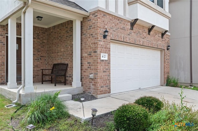 2105 Town Centre Dr Unit 42, Round Rock, TX 78664 - view of side of home featuring brick siding, driveway, and a porch