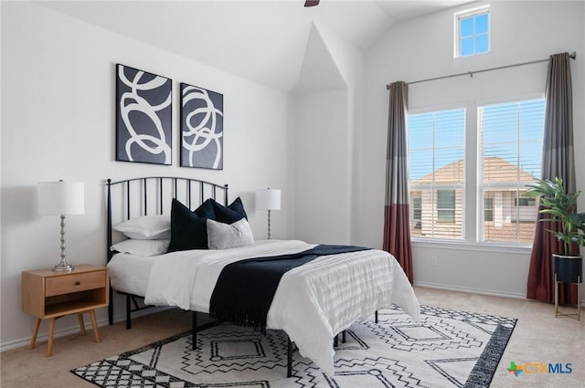 2105 Town Centre Dr Unit 42, Round Rock, TX 78664 - bedroom featuring light colored carpet and vaulted ceiling