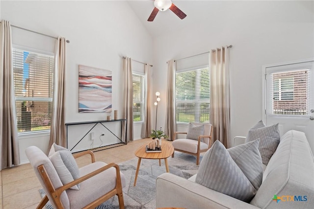 2105 Town Centre Dr Unit 42, Round Rock, TX 78664 - living area with a ceiling fan, light tile patterned flooring, and high vaulted ceiling