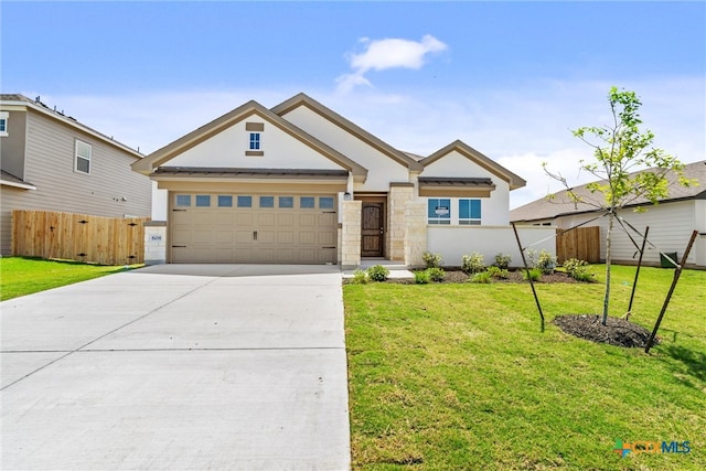 view of front of home with a garage and a front yard