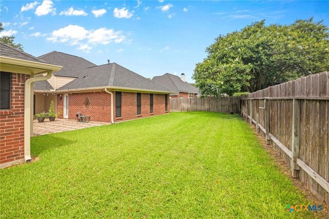 106 Westbrook Dr, Victoria, TX 77904 - fenced backyard featuring a patio area