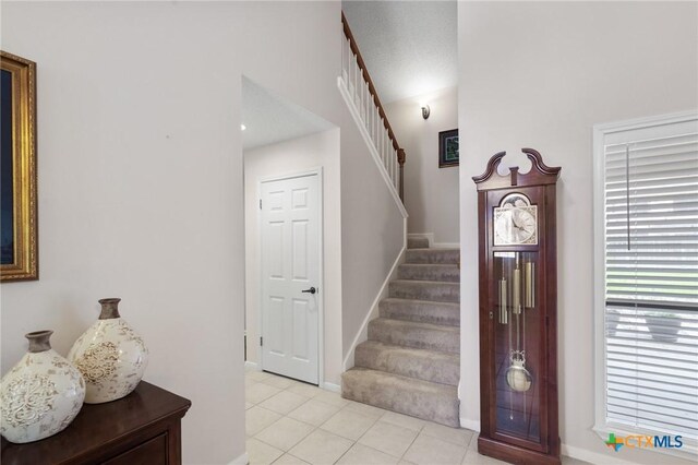 106 Westbrook Dr, Victoria, TX 77904 - entrance foyer featuring stairway and light tile patterned flooring
