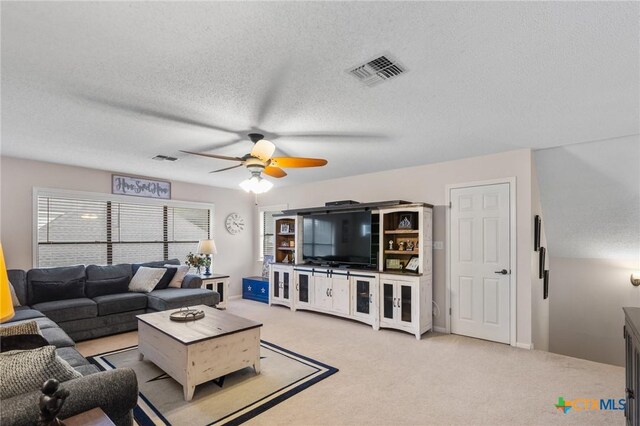106 Westbrook Dr, Victoria, TX 77904 - living area with a ceiling fan, light colored carpet, and a textured ceiling