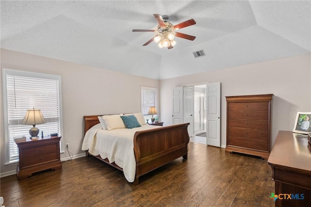 106 Westbrook Dr, Victoria, TX 77904 - bedroom with lofted ceiling, hardwood / wood-style flooring, a textured ceiling, and a ceiling fan