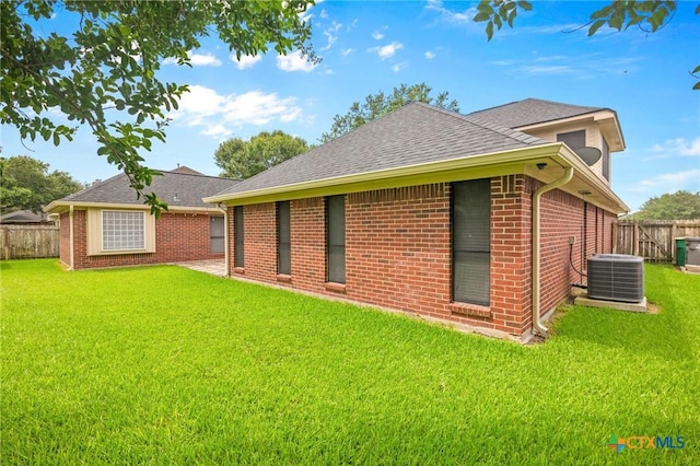 106 Westbrook Dr, Victoria, TX 77904 - back of house with brick siding and roof with shingles